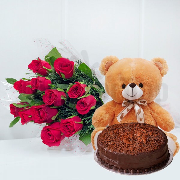 12 Red Roses in Cellophane Packing, Red Bow with Half Kg Chocolate Cake and 1 Teddy Bear (10 inches)